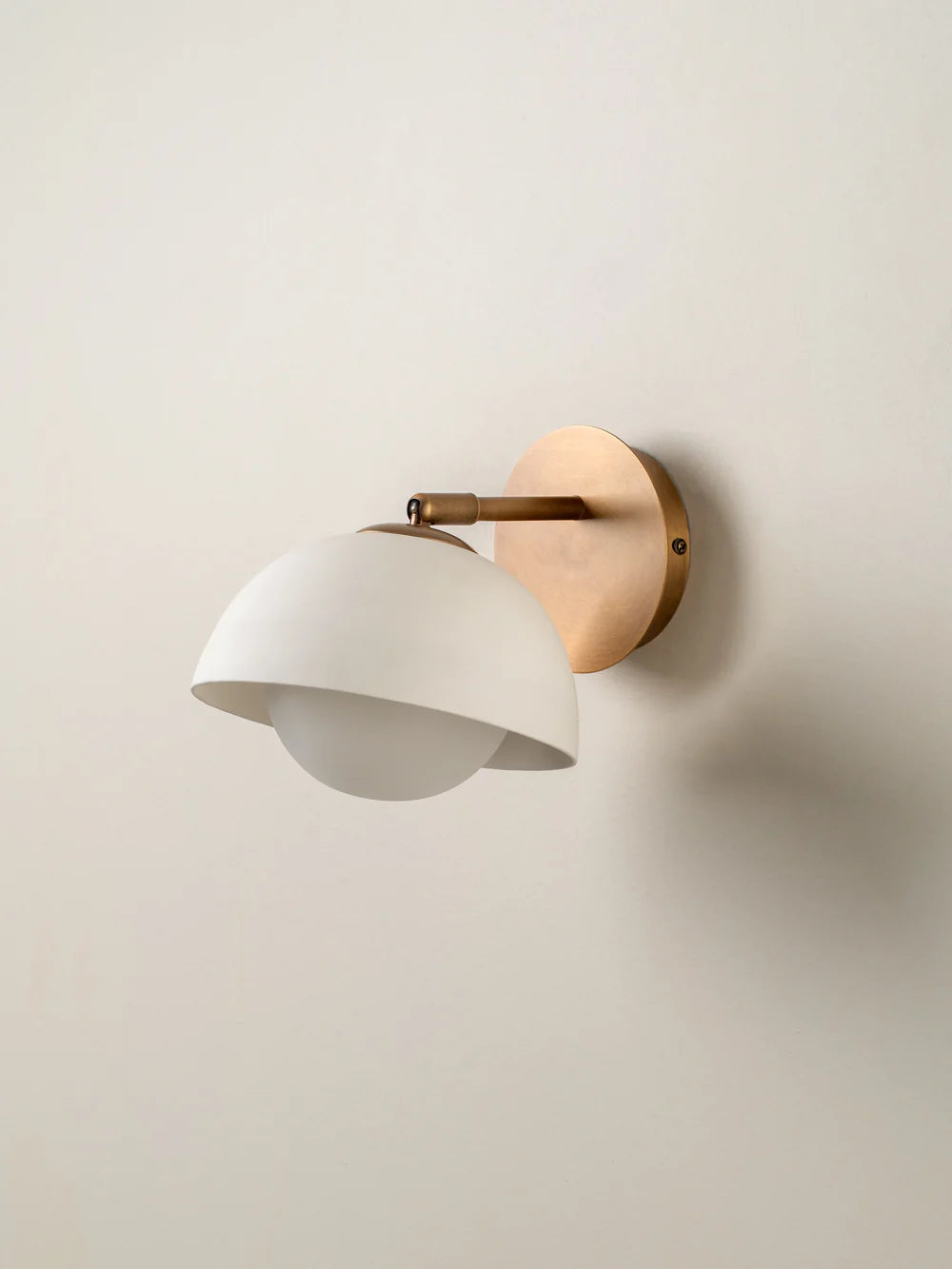 Porsa aged brass and warm white porcelain wall light
