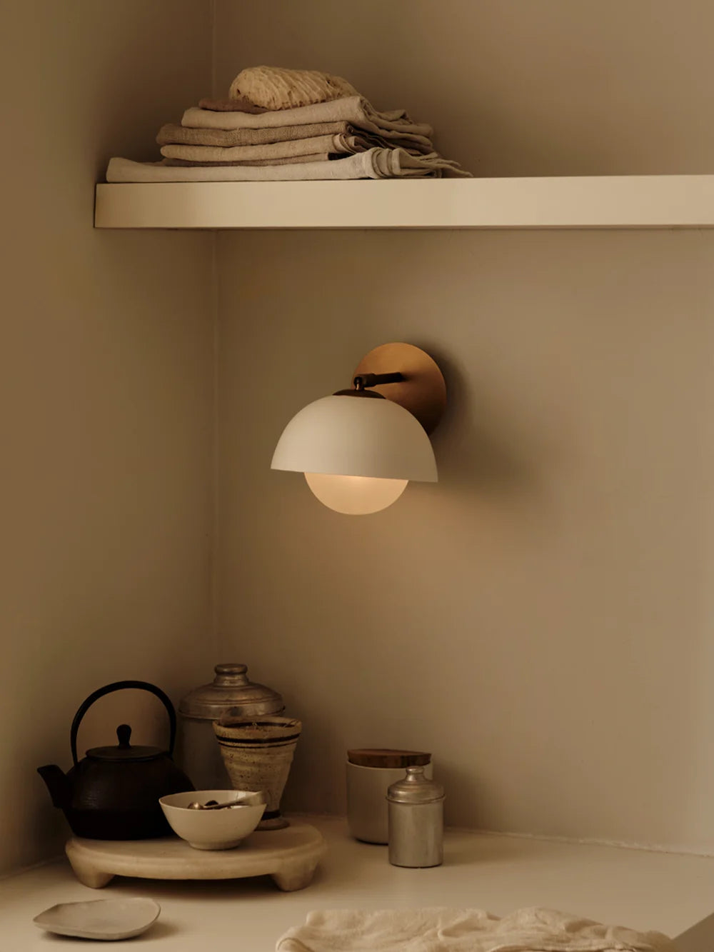 Porsa aged brass and warm white porcelain wall light