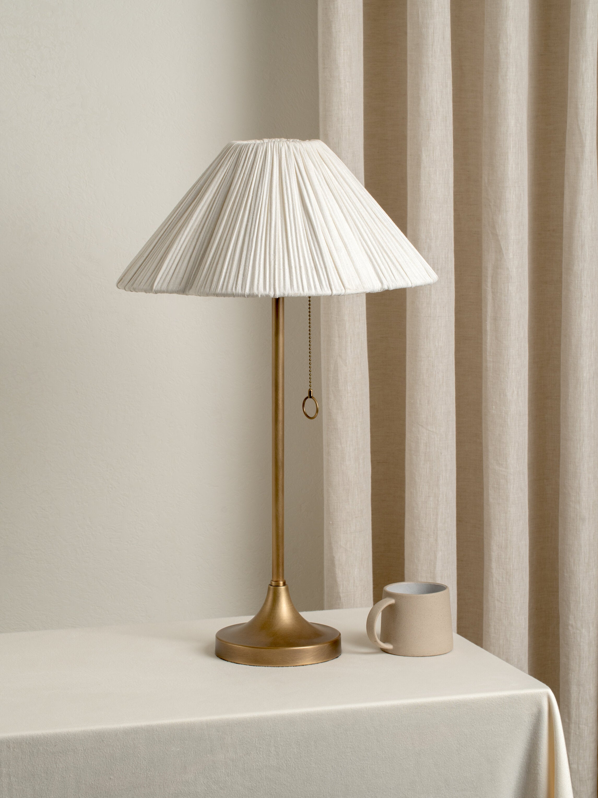Lindi - aged brass and scalloped linen table lamp | Table lamp | lights & lamps | UK | Modern affordable designer