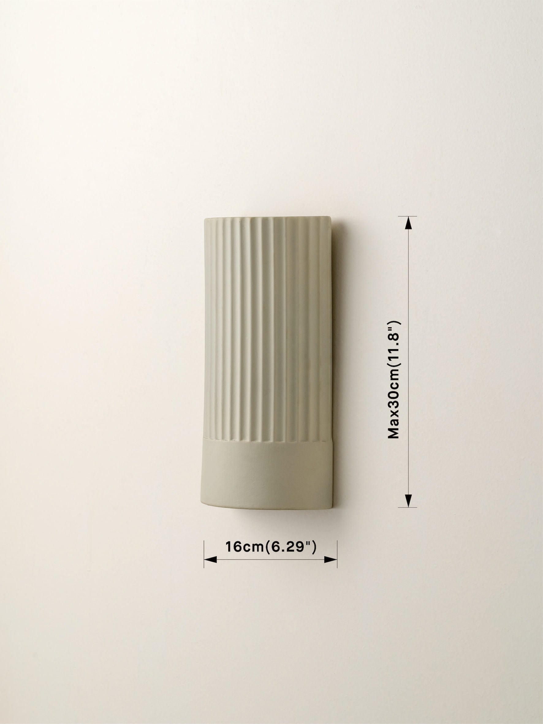 Enza - warm white ribbed concrete wall light