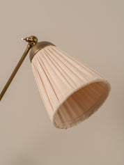 Lamp with a beige shade on a neutral background