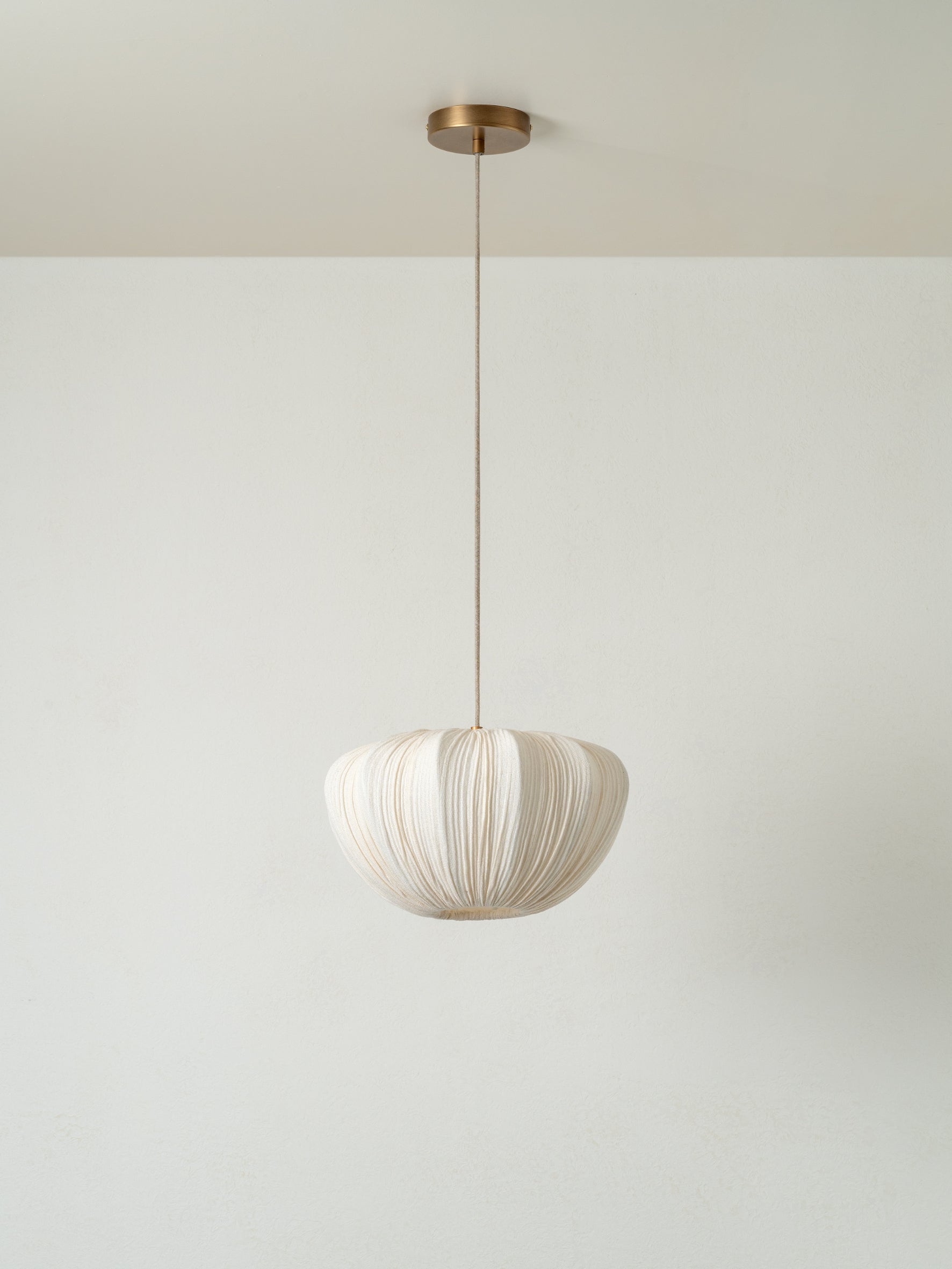 lights&lamps Ostrea pendant light with a pleated linen design on a plain background